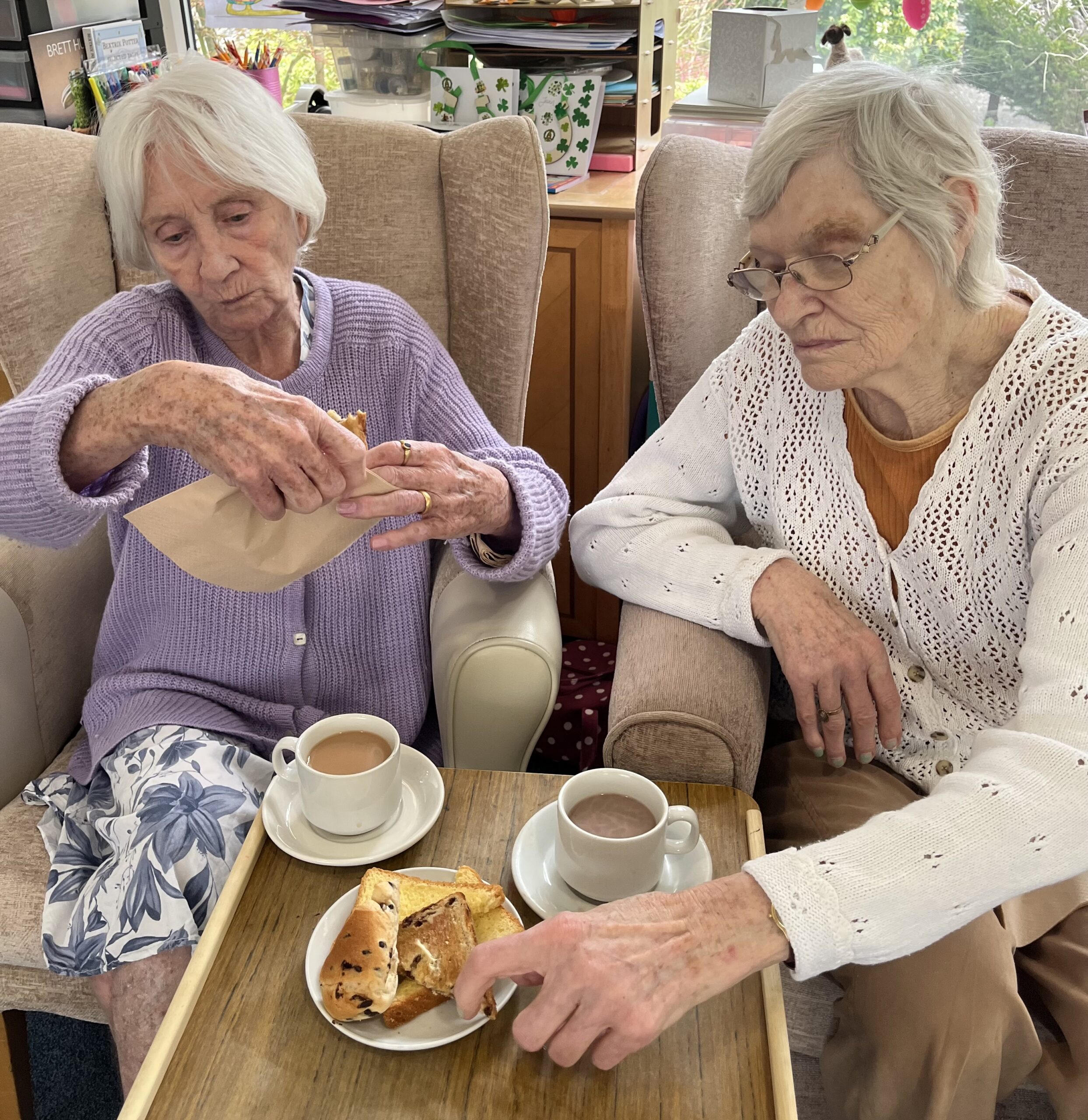 Residents enjoying a slice of sweet loaf and a cup of tea 1 scaled