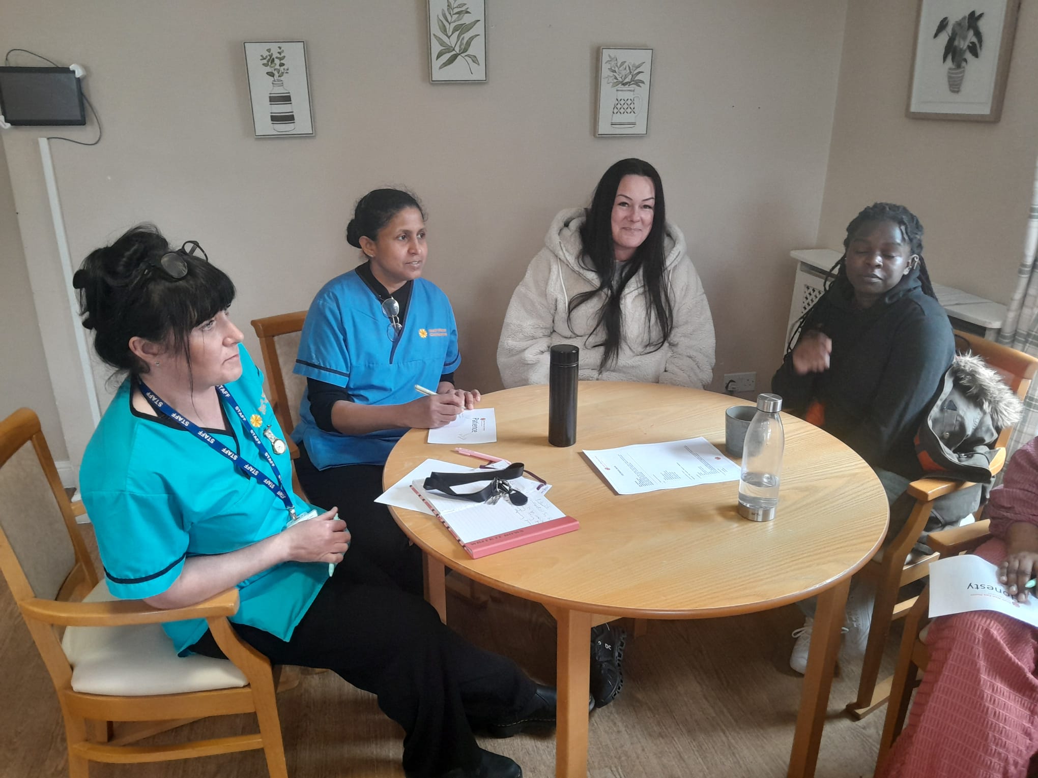 Group of four discussing the company values exercise