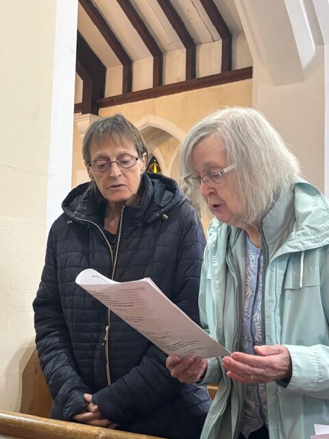 Residents stood singing a hymn rotated