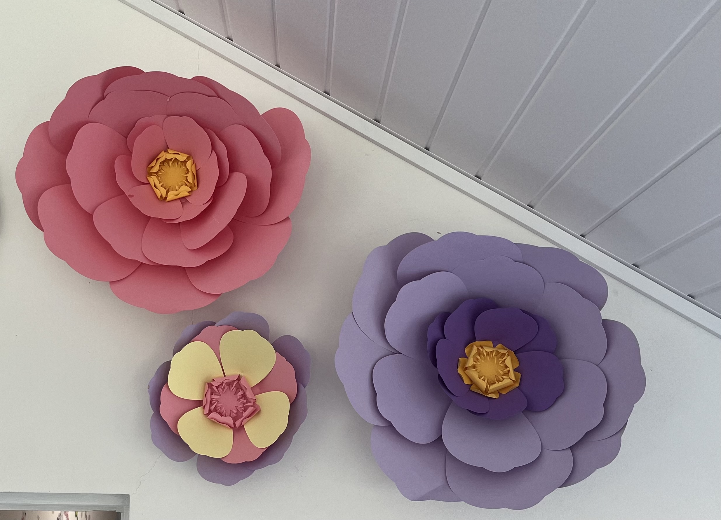 3 finished paper flowers in pink yellow lilac and purple