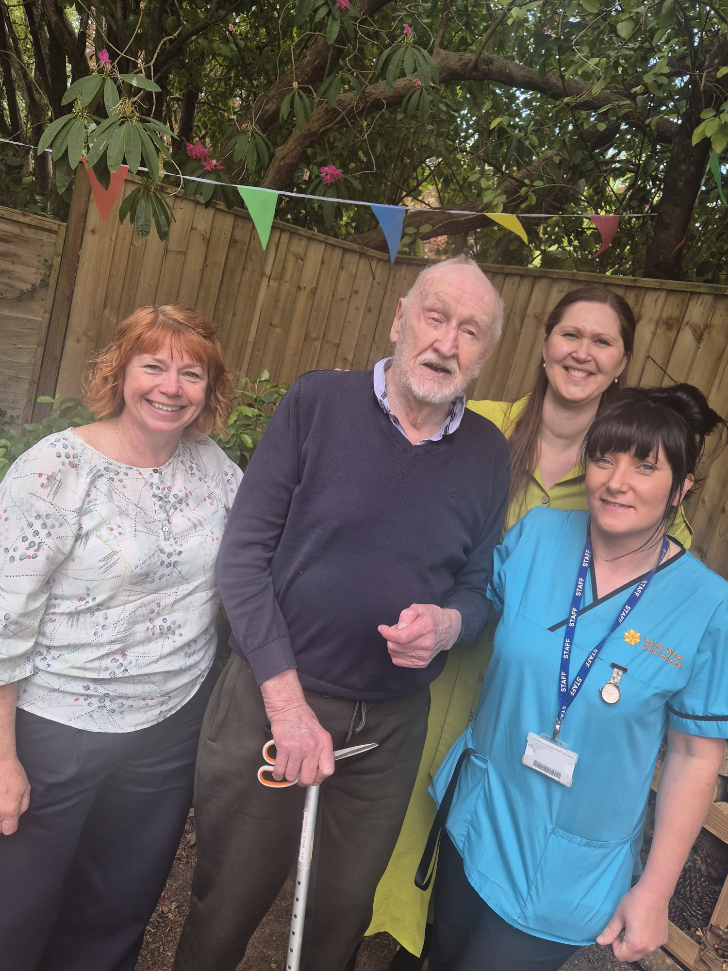 Amanda Ivor Janka and Billie standing together for a photo in the garden