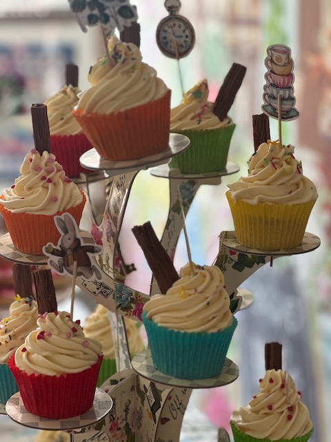 Close up of cupcakes with Mad Hatter decorations