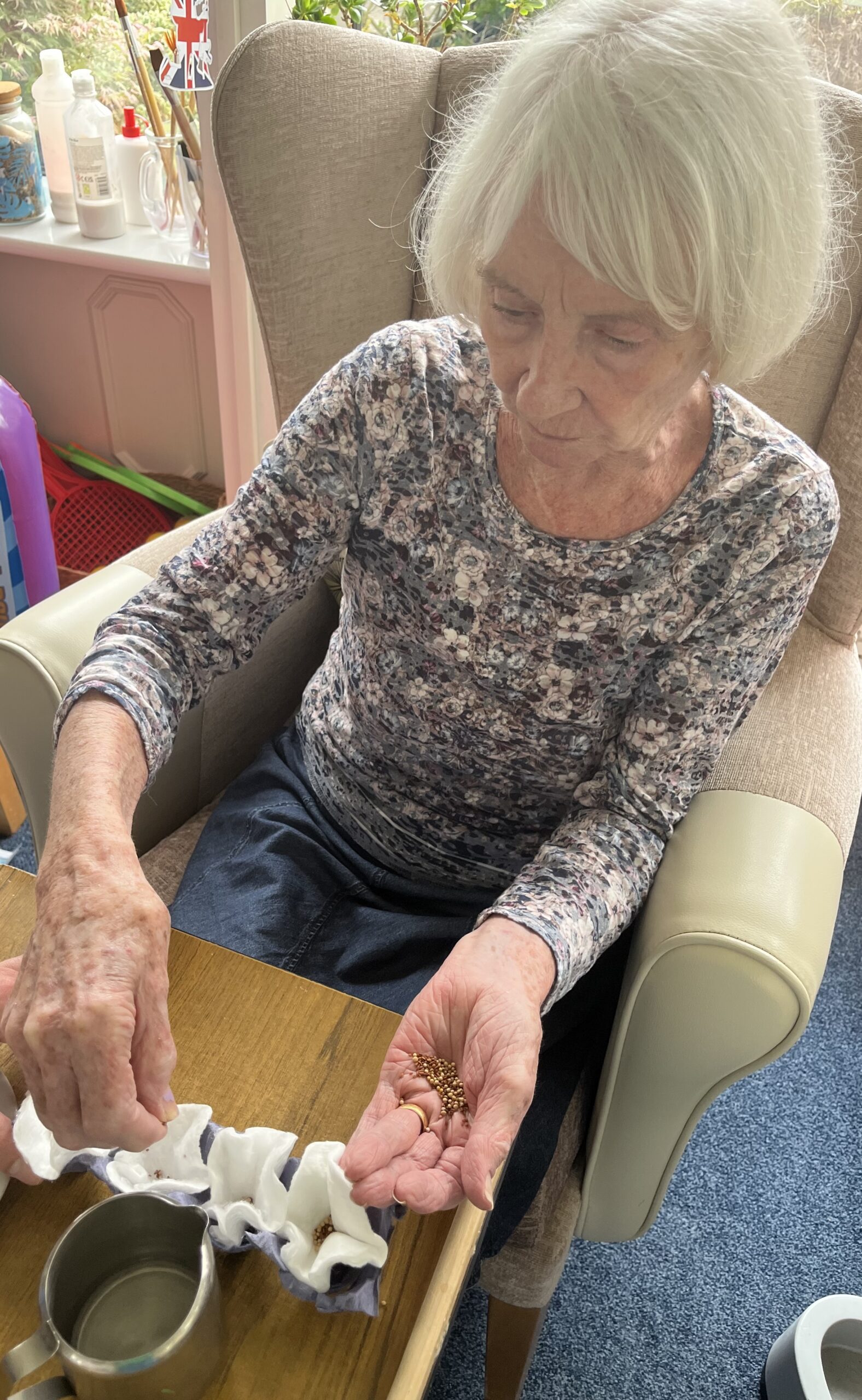 Jean sprinkling seeds into cotton padded egg box scaled